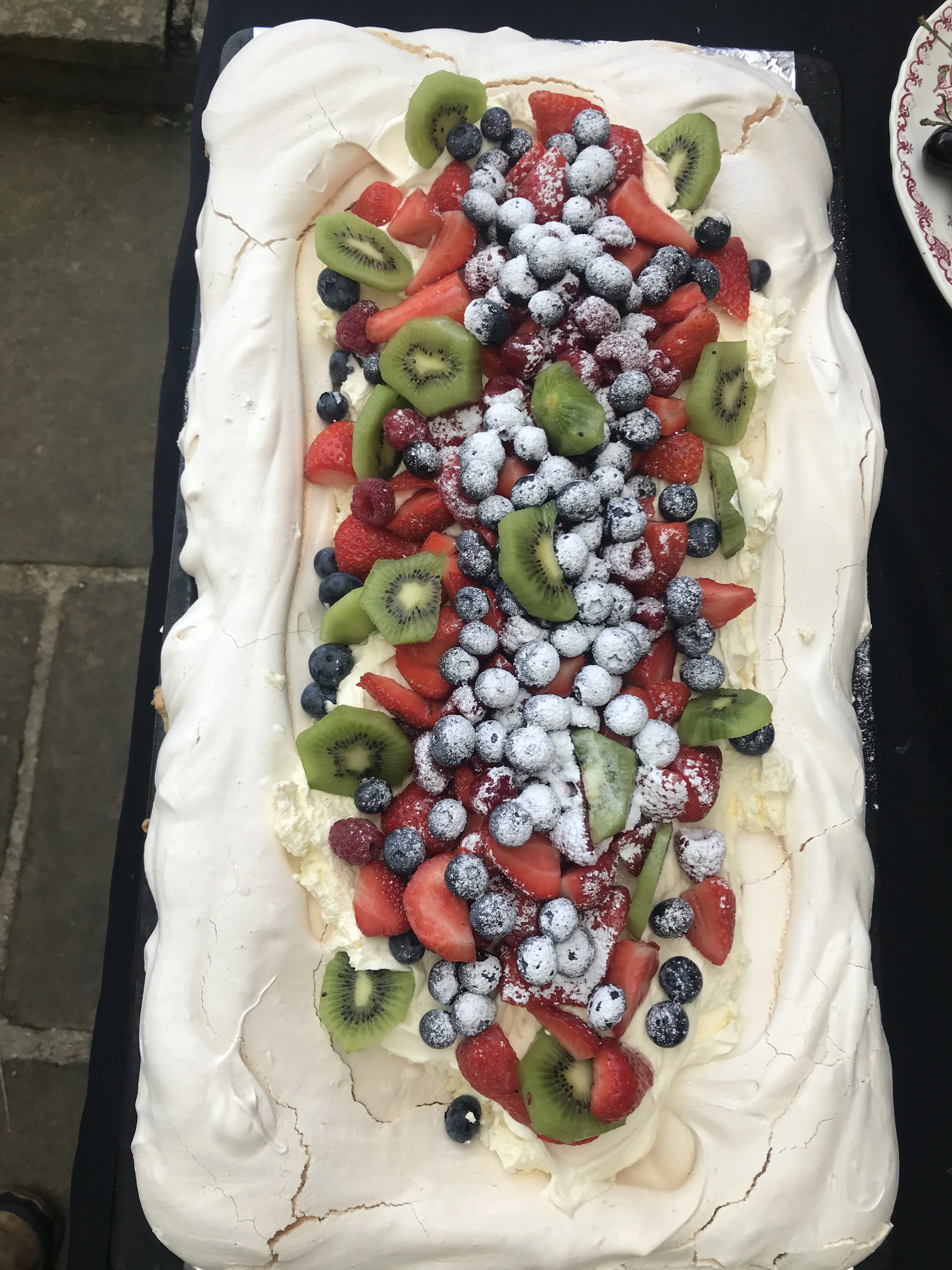 Oakfield Farm fruit pavlova topped with strawberries, blueberries and kiwi